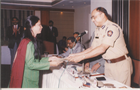 RECEIVING AWARD FOR COMMUNITY BETTERMENT GROM JOINT POLICE COMMISIONER